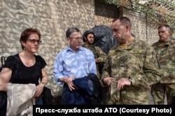 Volker (second from left) near the front line in eastern Ukraine