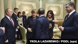 Сустрэча ў Менску лідэраў краін «нармандзкага фармату» (справа налева): прэзыдэнт Украіны Пятро Парашэнка, прэзыдэнт Францыі Франсуа Алянд, канцлер Нямеччыны Ангела Мэркель і прэзыдэнт Расеі Ўладзімір Пуцін, 11 лютага 2015