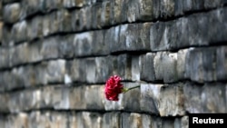 A carnation is placed by mourners on a barricade on Kyiv's Independence Square.