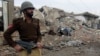 A Pakistani soldier at the site of a market destroyed in fighting between pro-Taliban militants and security forces in North Waziristan.