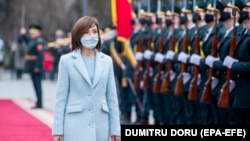 Maia Sandu reviews the honor guard in front of the presidential building after her inauguration ceremony i​n Chisinau, Moldova.