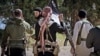 Fighters from the Balkans, including from Kosovo, appear in a propaganda video produced by the Islamic State extremist group in July 2015.