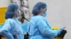 Armenia -- Medical workers are seen outside the Nork hospital in Yerevan where coronavirus patients are treated, March 20, 2020. 