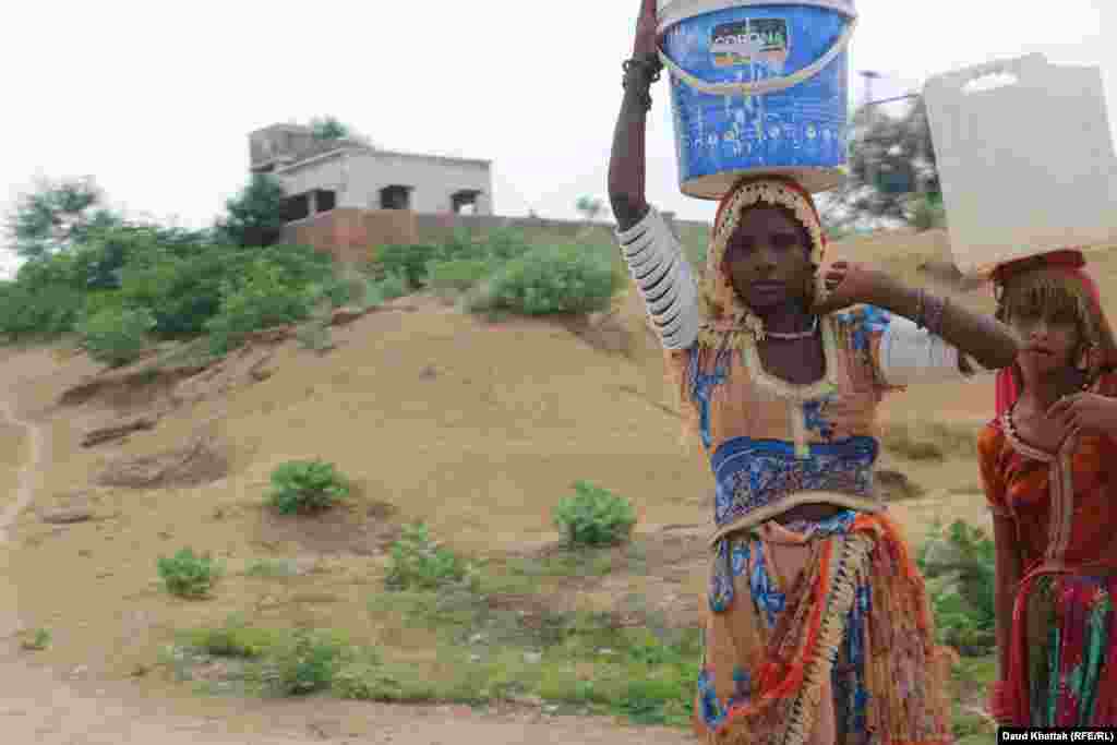 It is often women who are responsible for fulfilling the family’s water needs, and they bring water on their heads from as far as a kilometer away. 