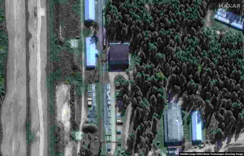 A section of the facility in Oktyabrskiy where possible missile canisters can be seen lined up next to a railway line on September 18. 