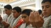 Iran -- Basij activists pray in Tehran, Jul2006