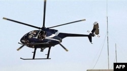 A private Blackwater helicopter flies over Baghdad