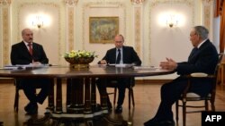 Russia -- (R-L) Kazakh president Nursultan Nazarbaev, Russian President Vladimir Putin and Belarus President Alyaksandr Lukashenka speak during their meeting in Putin's Novo-Ogaryovo residence outside Moscow, March 5, 2014