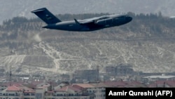 A U.S. Air Force aircraft takes off from the airport in Kabul on August 30, 2021.