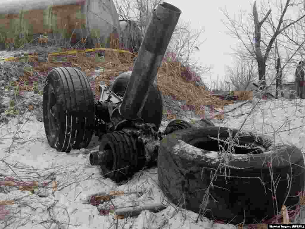 Landing gear lying in snow. Foggy weather is being cited as a possible factor in the crash. 