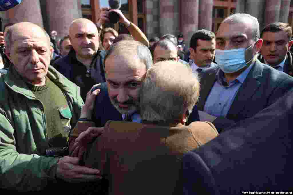 Pashinian hugs a supporter during his march through central Yerevan. 