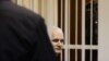 Алес Беляцкий, белорусский правозащитник и оппозиционер, на скамье подсудимых. Минск, 2 ноября 2011 года.
