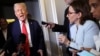 US President Donald Trump speaks to reporters on a flight to Washington on March 30.