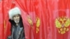 A man leaves a ballot booth at a polling station in Khakassia, Russia, in March.