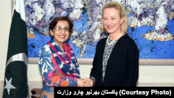 FILE: Alice Wells shaking hands with senior Pakistani diplomate Tahmina Janjua in January.