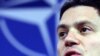 British Foreign Secretary David Miliband urged the future Afghan government to initiate a grassroots strategy to reconcile with and reintegrate insurgents.