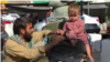 Afghanistan - near Torkham border crossing - Rizwanullah, from Nangarhar Province, and his child are going to Pakistan - screen grab