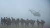U.S. marines await helicopter transport as part of Operation Khanjar in Helmand Province on June 2.