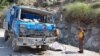 Pakistani rescue officials inspect the scene of a blast that targeted a bus carrying Chinese engineers to the site of the Dasu Dam in Upper Kohistan on July 14.