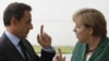 German Chancellor Angela Merkel (right) welcomes France's President Nicolas Sarkozy before talks in Berlin on July 20, where the two are said to have agreed a "common position" on the eurozone's debt crisis.