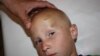 5-летний Коля Рожин из села Беловодское Чуйской области, 27 июня 2012 года.