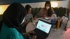 Women check out the online group The Soul Sisters Pakistan on Facebook, in Lahore in August 2020.