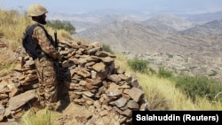 A Pakistani soldier stands guard at the Torkham crossing on the Pakistan-Afghanistan border.