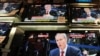 U.K. -- Televisions show former Prime Minister Tony Blair giving evidence to the Iraq War Inquiry in a shop in London, 29Jan2010