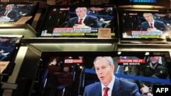 U.K. -- Televisions show former Prime Minister Tony Blair giving evidence to the Iraq War Inquiry in a shop in London, 29Jan2010