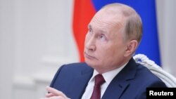 Vlagyimir Putyin egy konferencián Moszkvában 2021. november 30-án