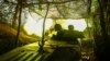 A self-propelled howitzer of the Ukraine's 57th Brigade fires in the direction of Russian positions on the outskirts of Kupyansk on April 21. 