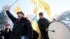 Demonstrators shout slogans while they take part in a rally of depositors in failed Ukrainian banks who demanded compensation of their deposits, in front of the parliament building in Kyiv on November 15.