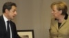French President Nicolas Sarkozy and German Chancellor Angela Merkel in Brussels on January 30