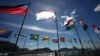 Flags of participating countries fly outside a TEDx summit in Rio de Janeiro in June.