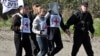 Ադրբեջանցի Armenia -- International Committee of the Red Cross officials carry their flag as they follow Armenian servicemen escorting Eldar Tagiyev, an Azerbaijani hostage, near the village of Kayan, 04Nov2010