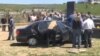 Armenia - Law-enforcement officers inspect a car in which a senior police officer, Koryun Harutiunian, was found dead, Hrazdan, 2May2013.