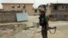 A member of an Afghan commando unit stands guard in a Kunduz district. (file photo)