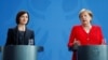 Moldovan Prime Minister Maia Sandu (left) and German Chancellor Angela Merkel attend a joint news conference at the Chancellery in Berlin on July 16.