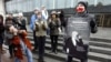 A gay-rights activist holds a placard displaying the image of 19th-century composer Pyotr Tchaikovsky during an unsanctioned protest rally to defend the rights of Russian gays and lesbians in St. Petersburg on April 7.