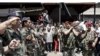 Lebanon - Lebanese soldiers carry the bodies of their colleagues Mouemen Al Husseini and Jihad Chamtieh during their funeral procession in the northern Lebanese city of Tripoli, 21May2007