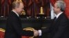 Russia - President Vladimir Putin (L) greets his Armenian counterpart Serzh Sarkisian at a CSTO summit in Moscow, 19Dec2012.