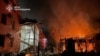 Buildings are damaged and in flames after an attack on Kremenchuk, Ukraine, on June 6