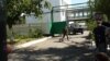 Выезд автомобиля с территории штаба погранотряда. Город Ушарал Алматинской области, 9 июня 2012 года. 