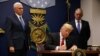 U.S. President Donald Trump signing his temporary ban on refugees earlier this year