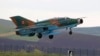 A MiG-21 Lancer takes off during training exercises at a military airfield in Campia Turzii in Transylvania, Romania, in 2014.