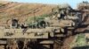 Ізраїльські важкі бронетранспортери «Ахзаріт» поблизу кордону зі Сумгою Газа, 6 січня 2009 р.