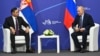 Serbian Deputy Prime Minister Aleksandar Vulin (left) and Russian President Vladimir Putin meet in Vladivostok on September 4.