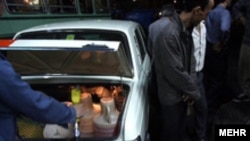 Iranians, like this car owner loading fuel illegally into his car in 2007, are no strangers to gas crunches.