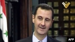 Syria -- A TV grab shows President Bashar al-Assad speaking during an interview with al-Manar in Damascus, 30May2013