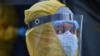 A medical worker wearing protective gear is seen outside the Grigor Lusavorich Medical Center in Yerevan on June 9.